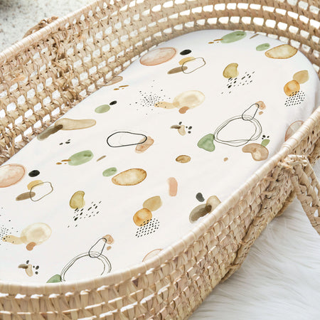 Baby bassinet cotton spandex fitted sheet with multi colours, green, brown, mustard cream background with multi colours, green, brown, mustard.