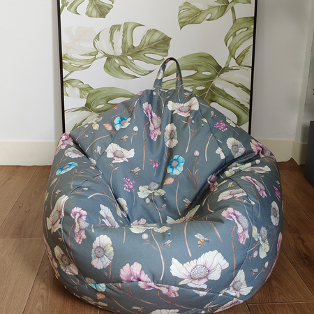 teardrop kids bean bag with soft water-colour floral pattern greenish grey background