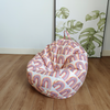 This isteardrop kids bean bag with Holly  pattern  of colourful rainbows 